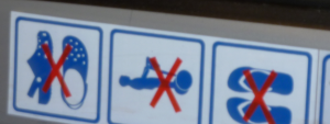 sign from Barcelona Airport: no crocs, no segways, no flipflops