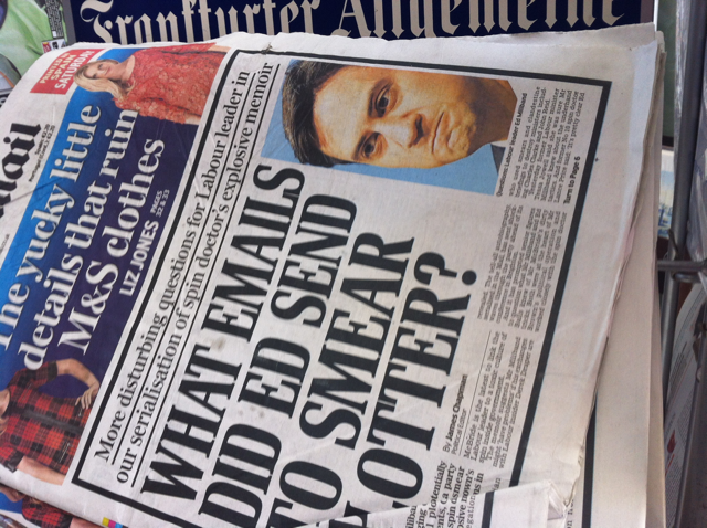 Folded newspaper reveals the headline "What emails did Ed send to smear otter?"